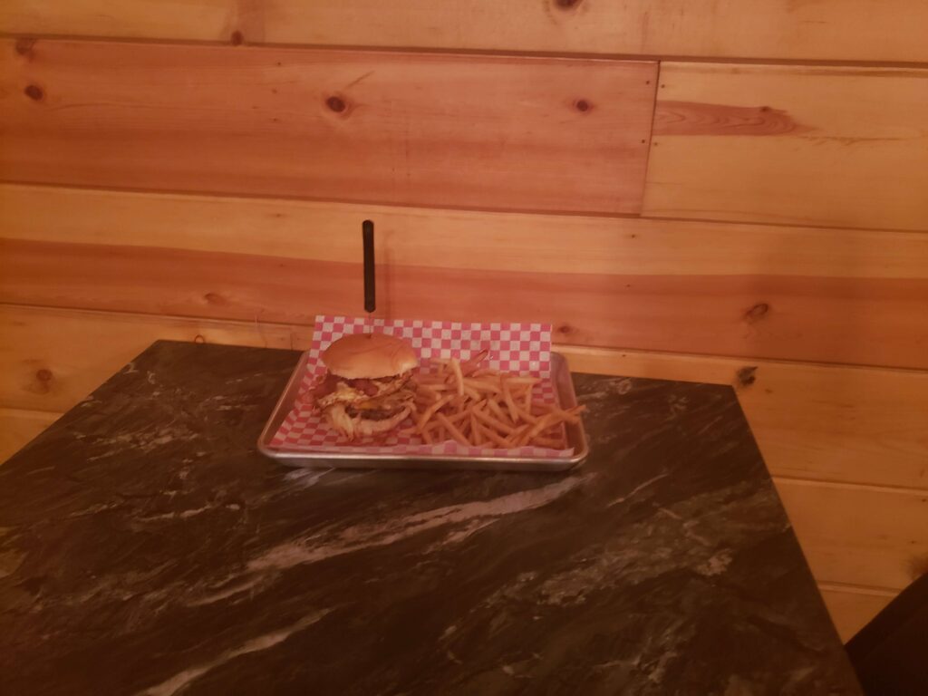 a meal on a stylized metal tray for The Yard Bar & Grill in Alton, IA
